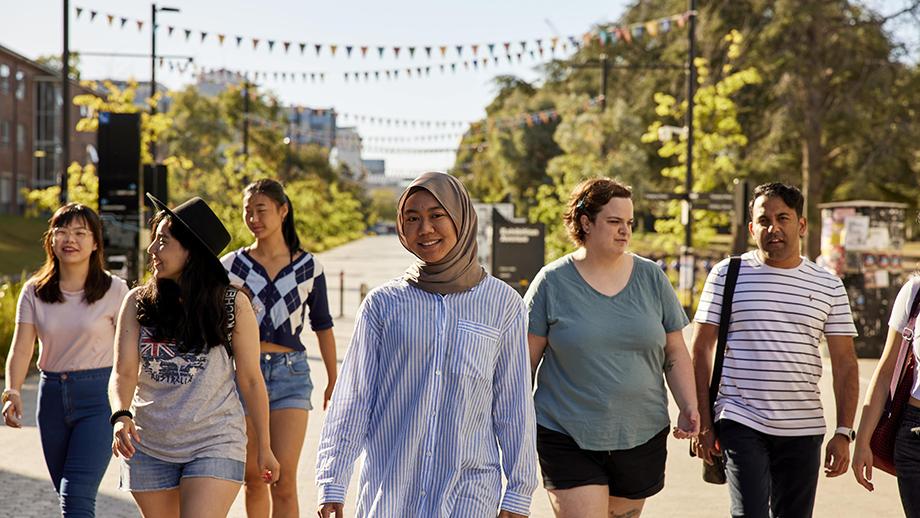 Few student walking in the ANU campus